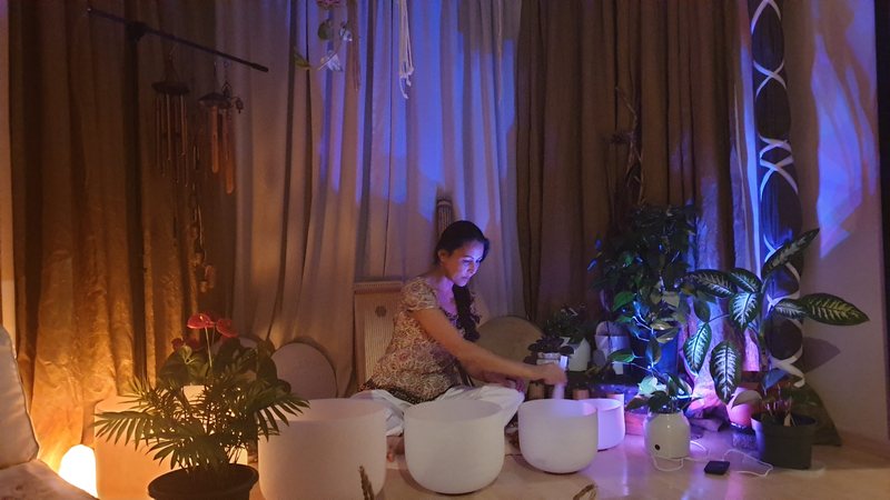 Carolina playing crystal bowls during a previous Luminous Five session.